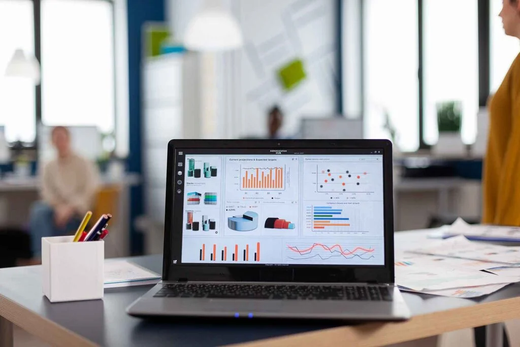 laptop with company financial charts on office des LZC785R 1